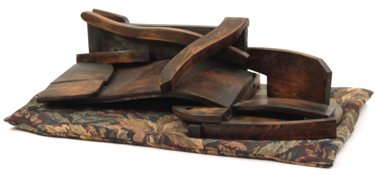 sculpture made from salvaged bits of wood chairs
